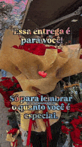 a bouquet of red roses is wrapped in brown paper with a heart on it