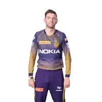 a man wearing a nokia shirt holds his arms up in the air
