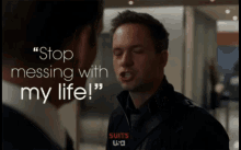 a man says " stop messing with my life " while another man looks on