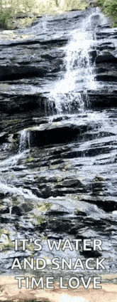 a waterfall is surrounded by rocks with a caption that says it 's water and snack time love .