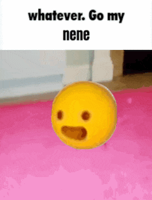 a yellow smiley face is floating on a pink mat .