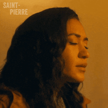 a close up of a woman 's face with the word saint-pierre written on the bottom