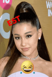 a close up of ariana grande 's face with a smiley face and the word est on her head