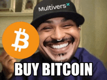a man wearing a hat that says multivers is smiling and holding a sign that says buy bitcoin