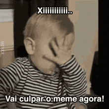a baby is covering his face with his hand and the caption vai culpar o meme agora