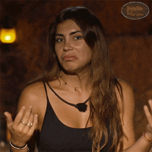 a woman says me da un poco igual while clapping