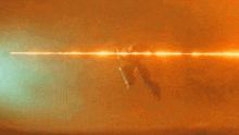 a bright orange background with a white light coming out of the middle
