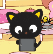 a black cat with yellow ears holding a tablet