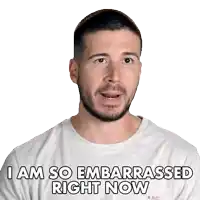 a man with a beard is wearing a grey shirt that says i am so embarrassed right now