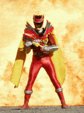 a red power ranger with a yellow cape