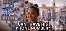 a woman in a store is smiling and asking can i have his phone number ?