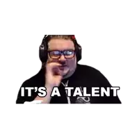 a man wearing headphones and glasses is saying it 's a talent .