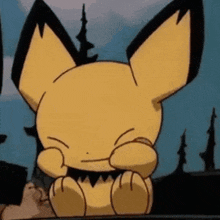 a close up of a cartoon character sitting on a table with its eyes closed .
