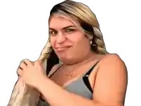 a woman in a gray tank top is holding her hair and making a funny face