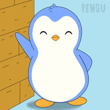 a blue and white penguin is standing in front of a wall and the word pengu is on the bottom right